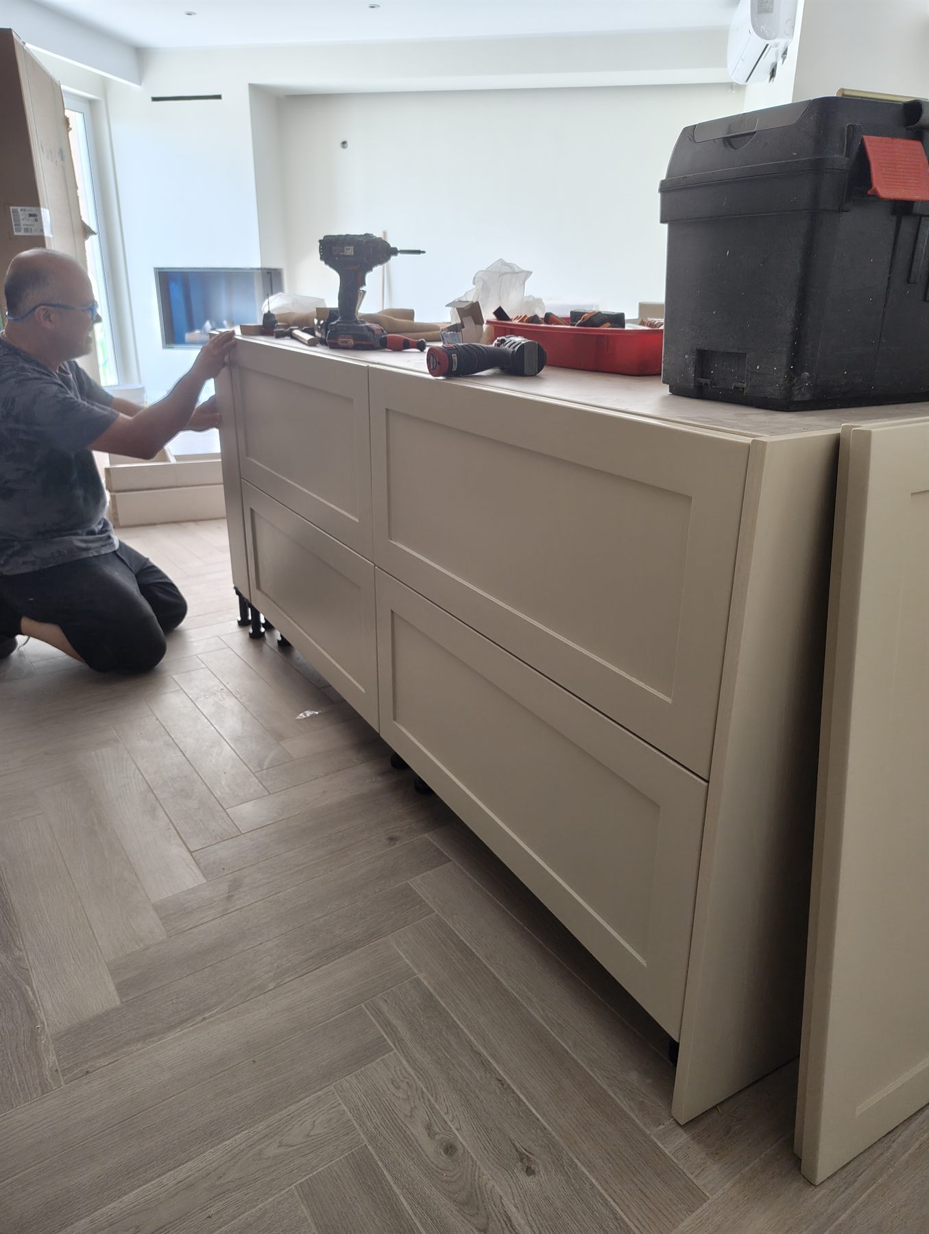 Dean Paul fitting a run of custom cabinetry