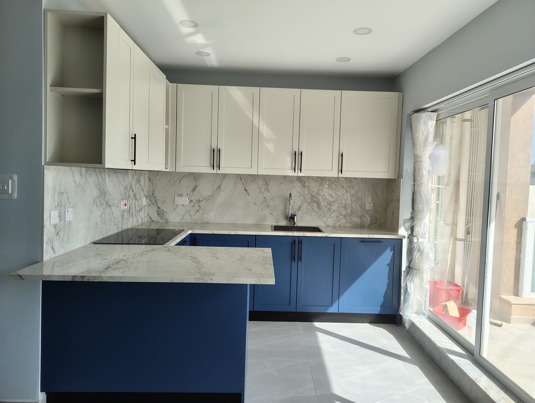 Navy kitchen with integrated appliances