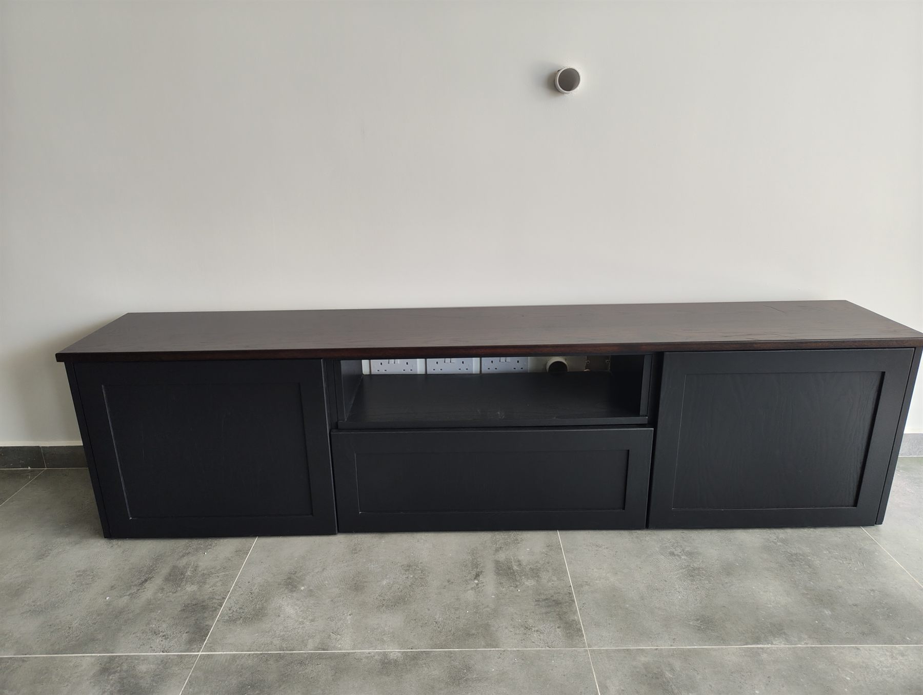 Black TV unit with solid walnut top