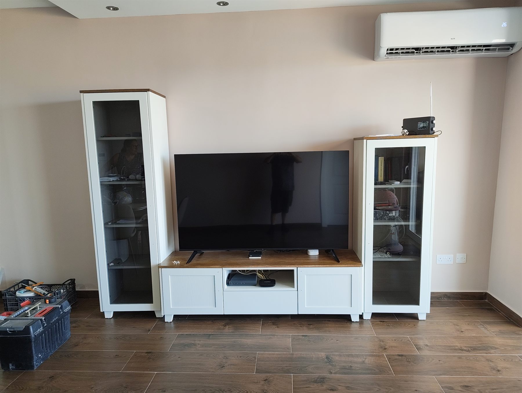 White TV unit with oak top and matching glass display cabinets