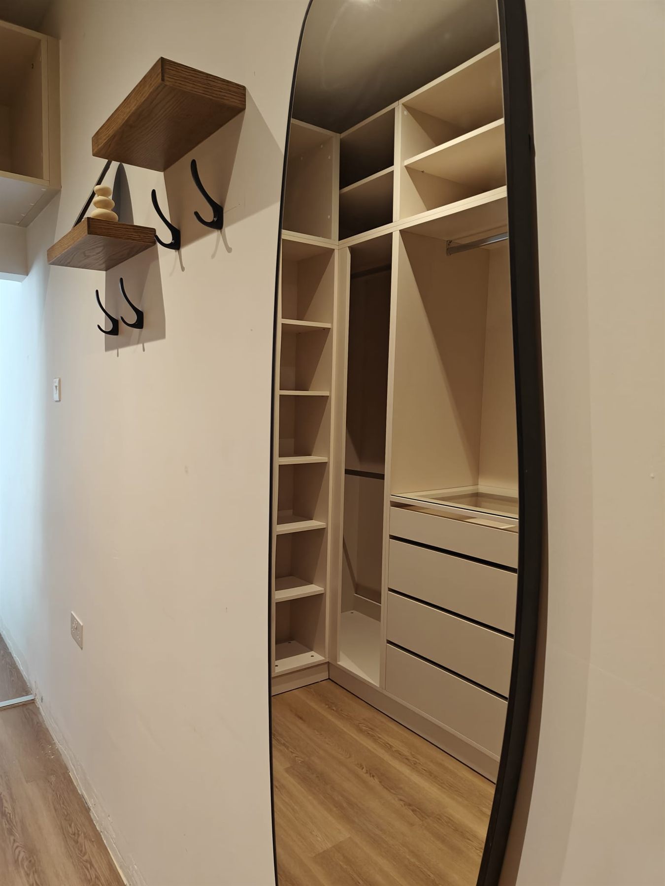 Walk-in wardrobe with open shelving and drawers
