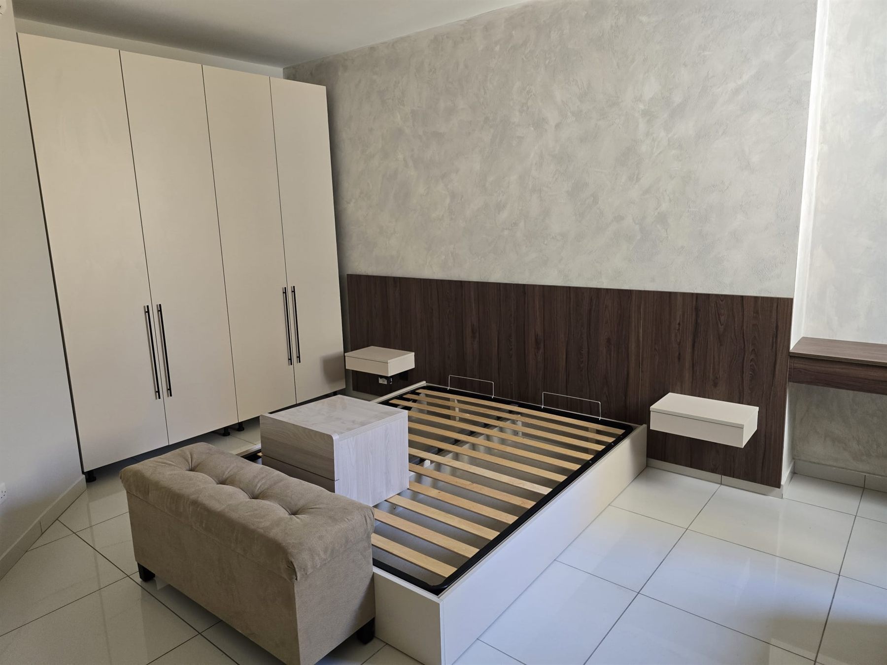 Fitted bedroom with wardrobes and floating bedside tables