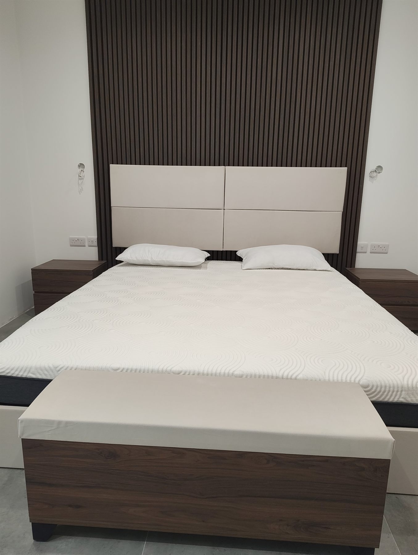 Modern bedroom joinery with walnut detailing
